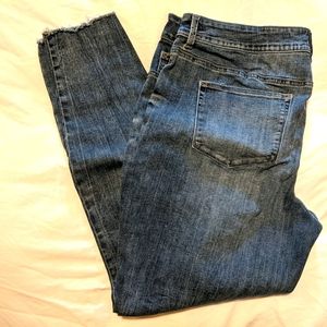 Tall jeans with frayed bottoms, distressed